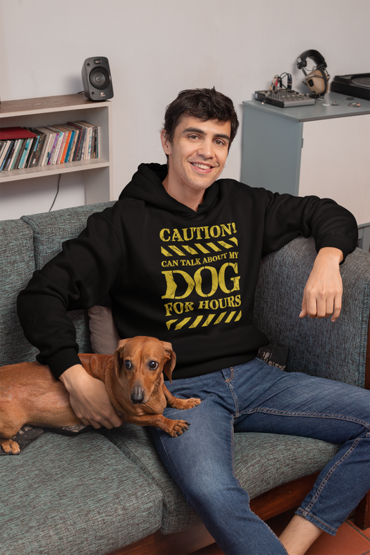 Man wearing black hoodie posing with his cute dog