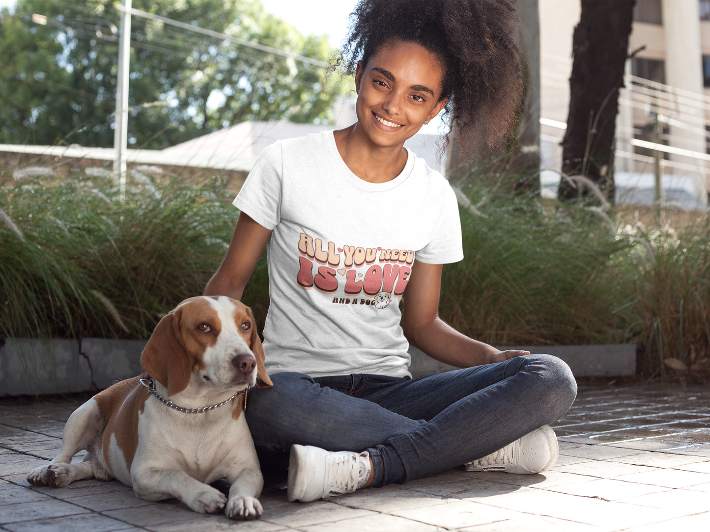 Woman posing with her cute dog wearing dog mom tshirt