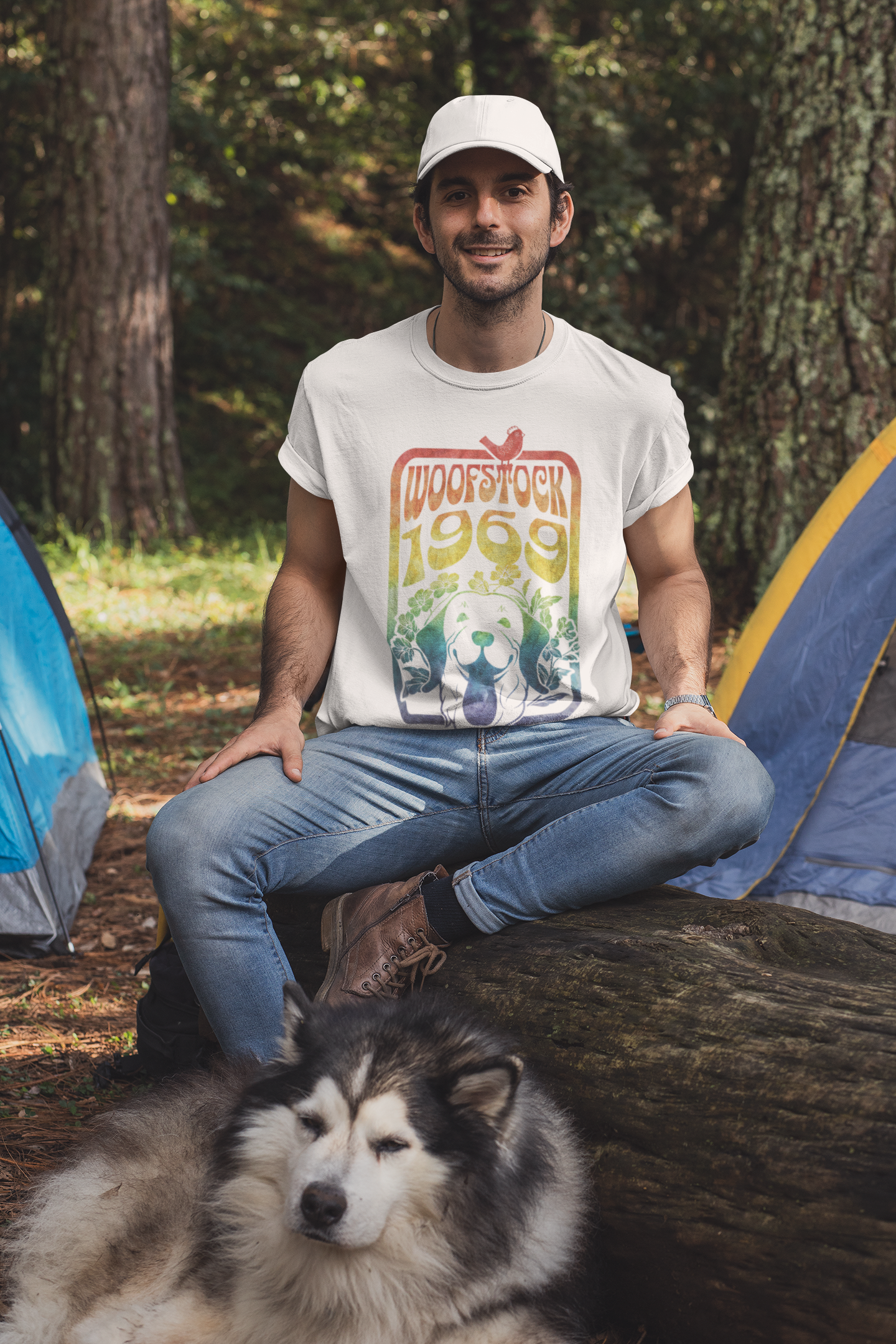 Guy camping with his dog wearing Woofstock 1969 black tshirt featuring dog